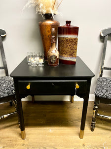 Black hand-painted side table with storage drawer