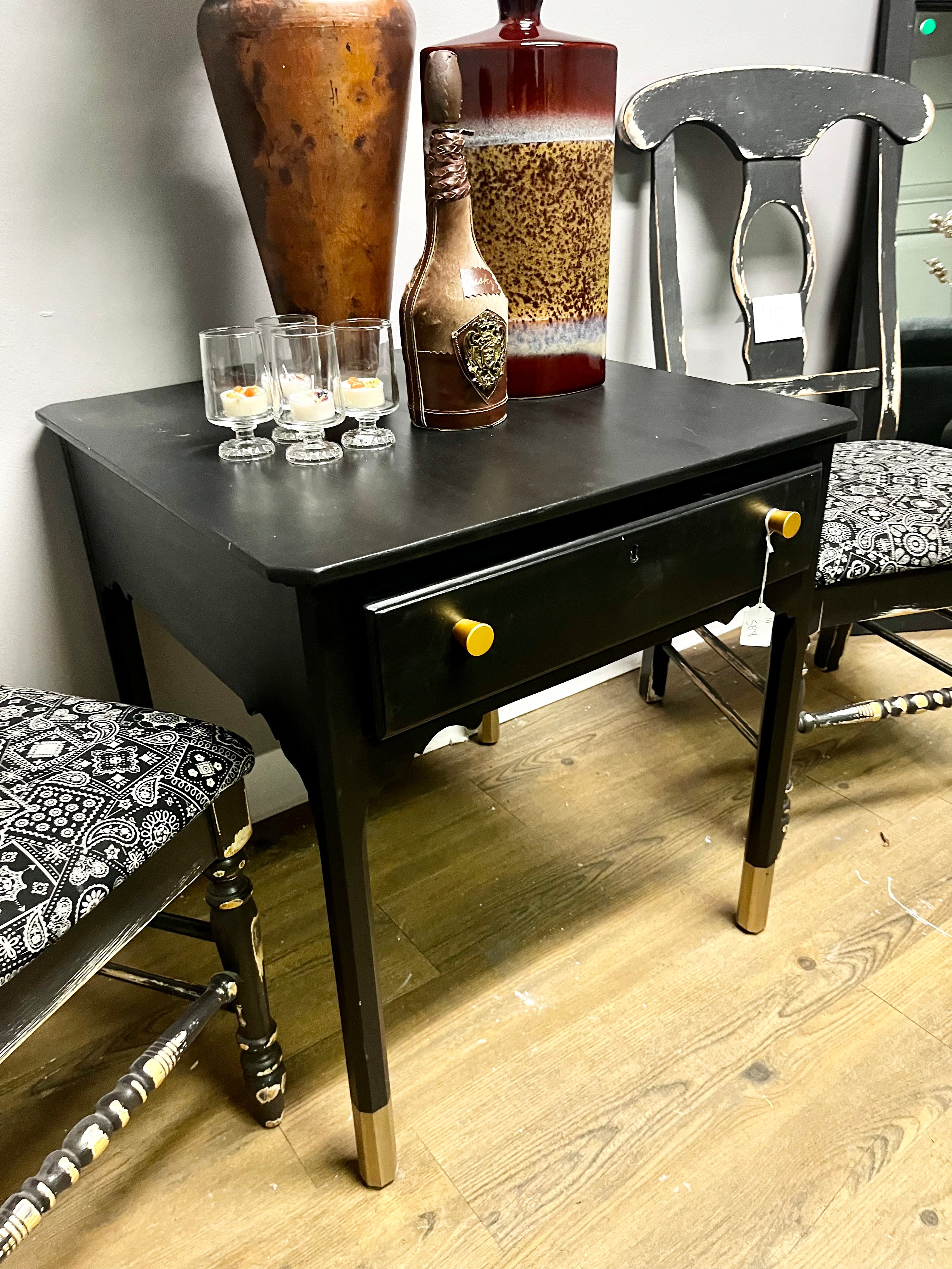 Black hand-painted side table with storage drawer