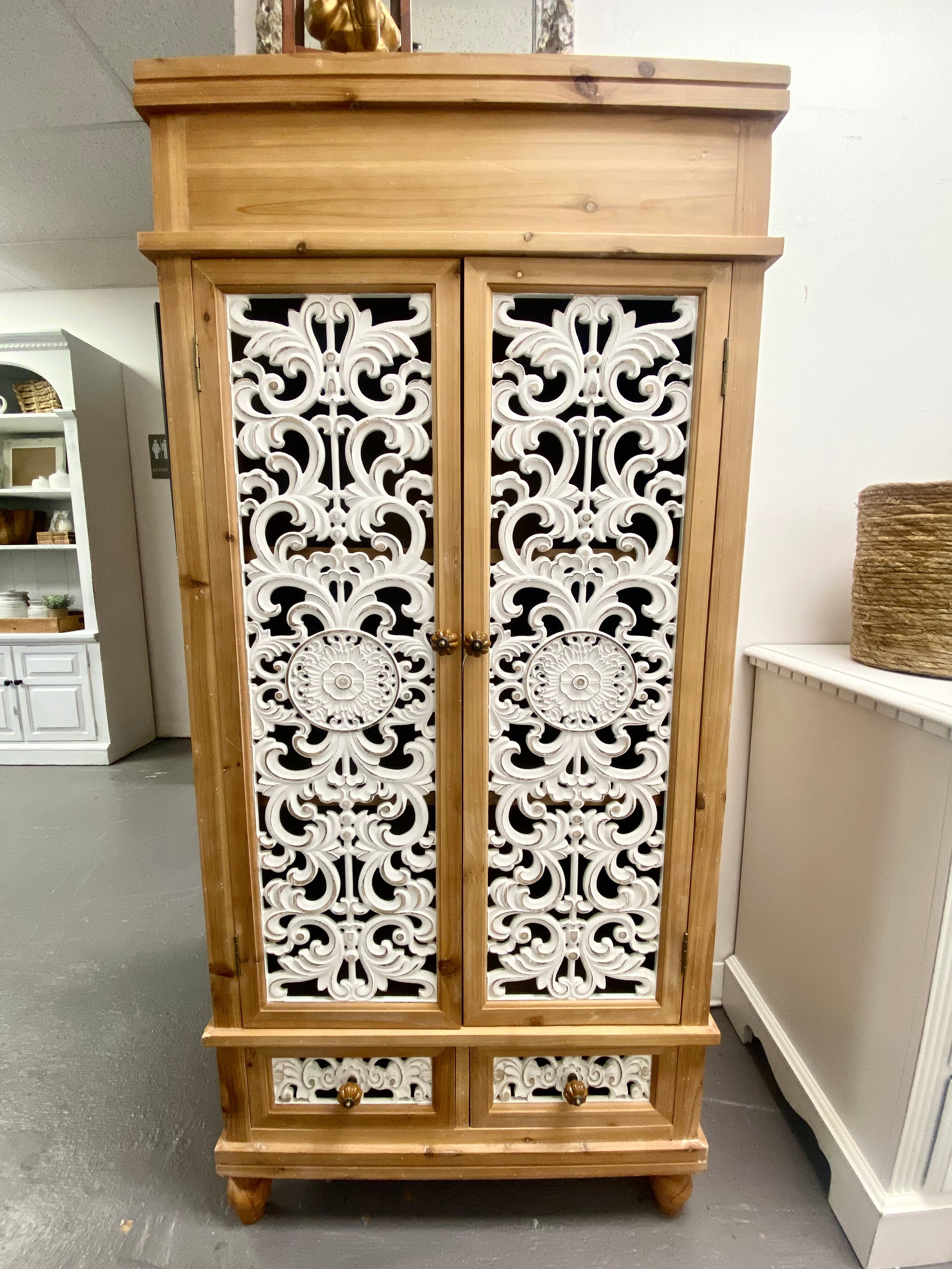 Ornate hollow-carved wooden cabinet